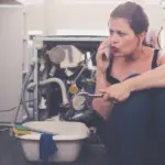 Lady dealing with dishwasher leaks