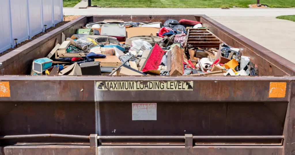 Dumpster full of the contents of a hoarding cleanup service