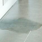 water rising from under a kitchen floor